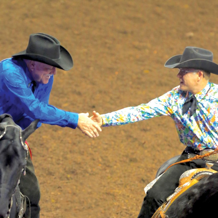 Two Riders Shaking Hands